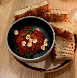 tomato-hazelnut dip with basil, olive oil and focaccia